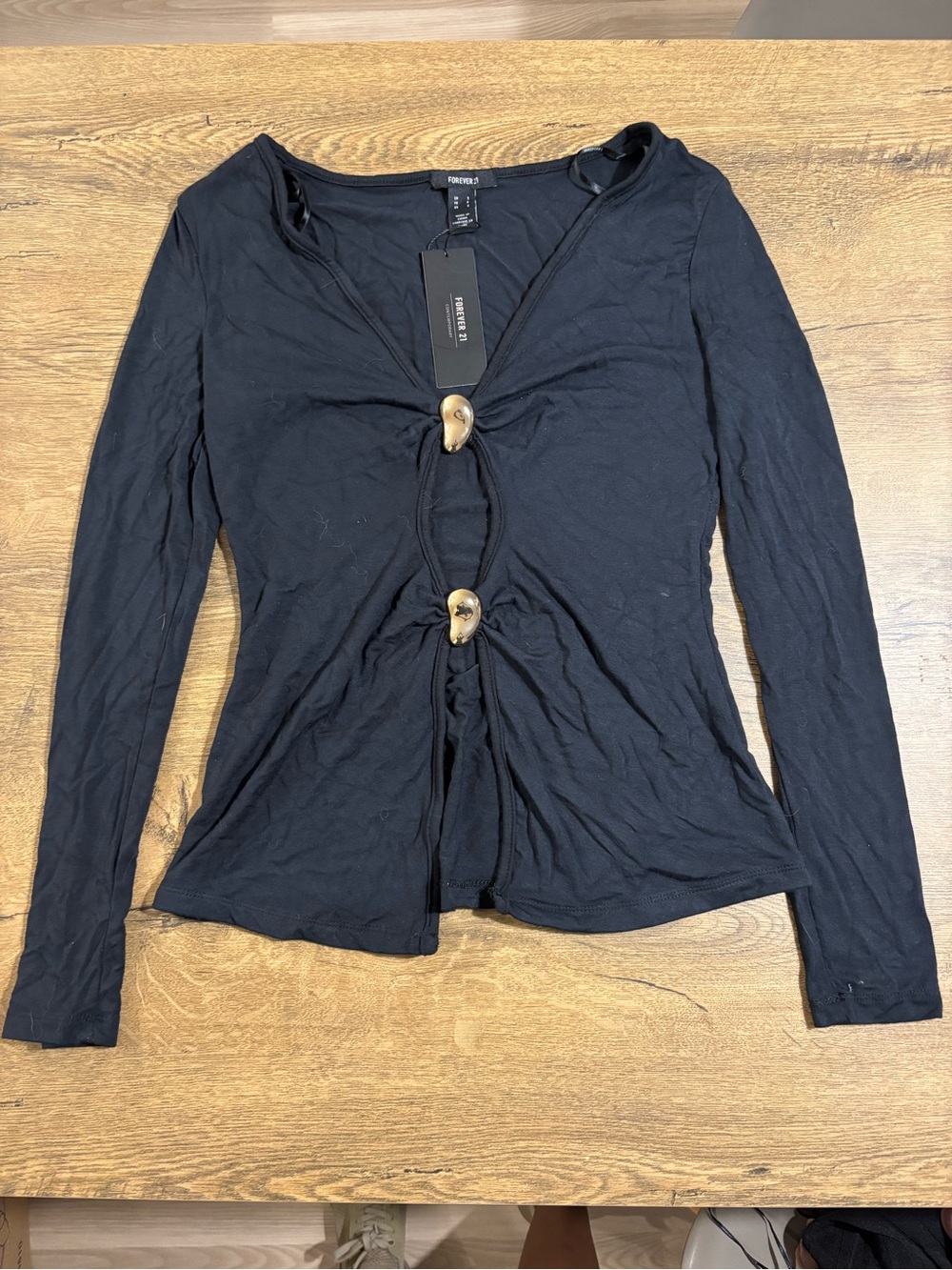 Black Long Sleeve Twist-Front Top with gold Button Accents